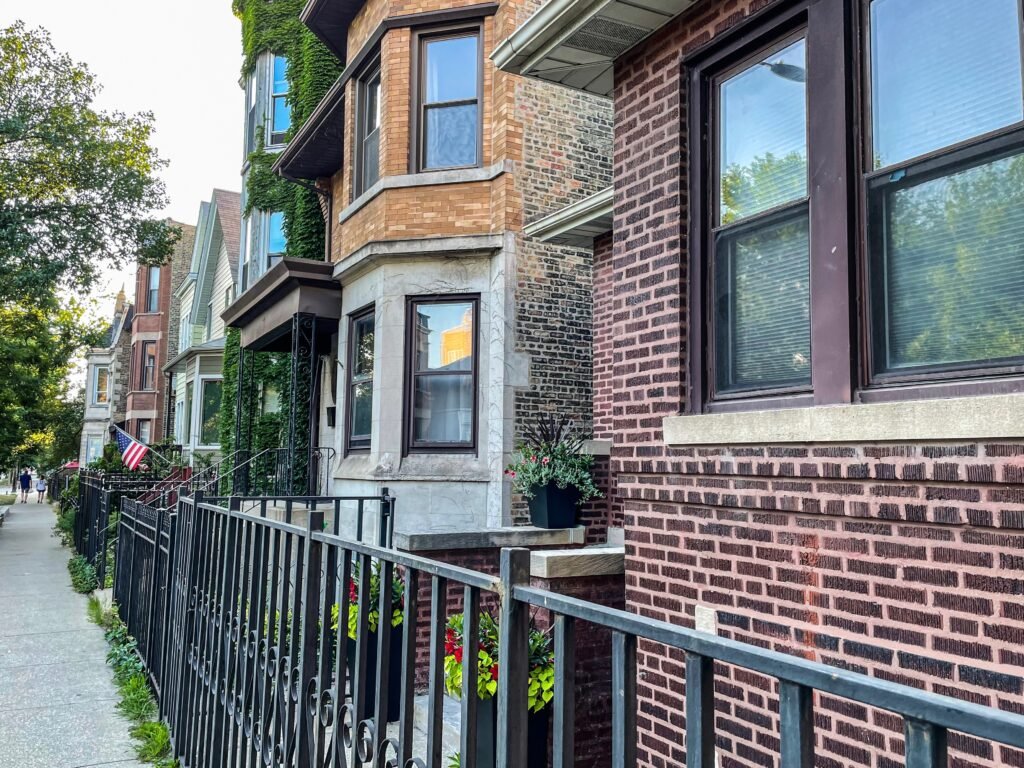 summer brownstone sidewalk with flag